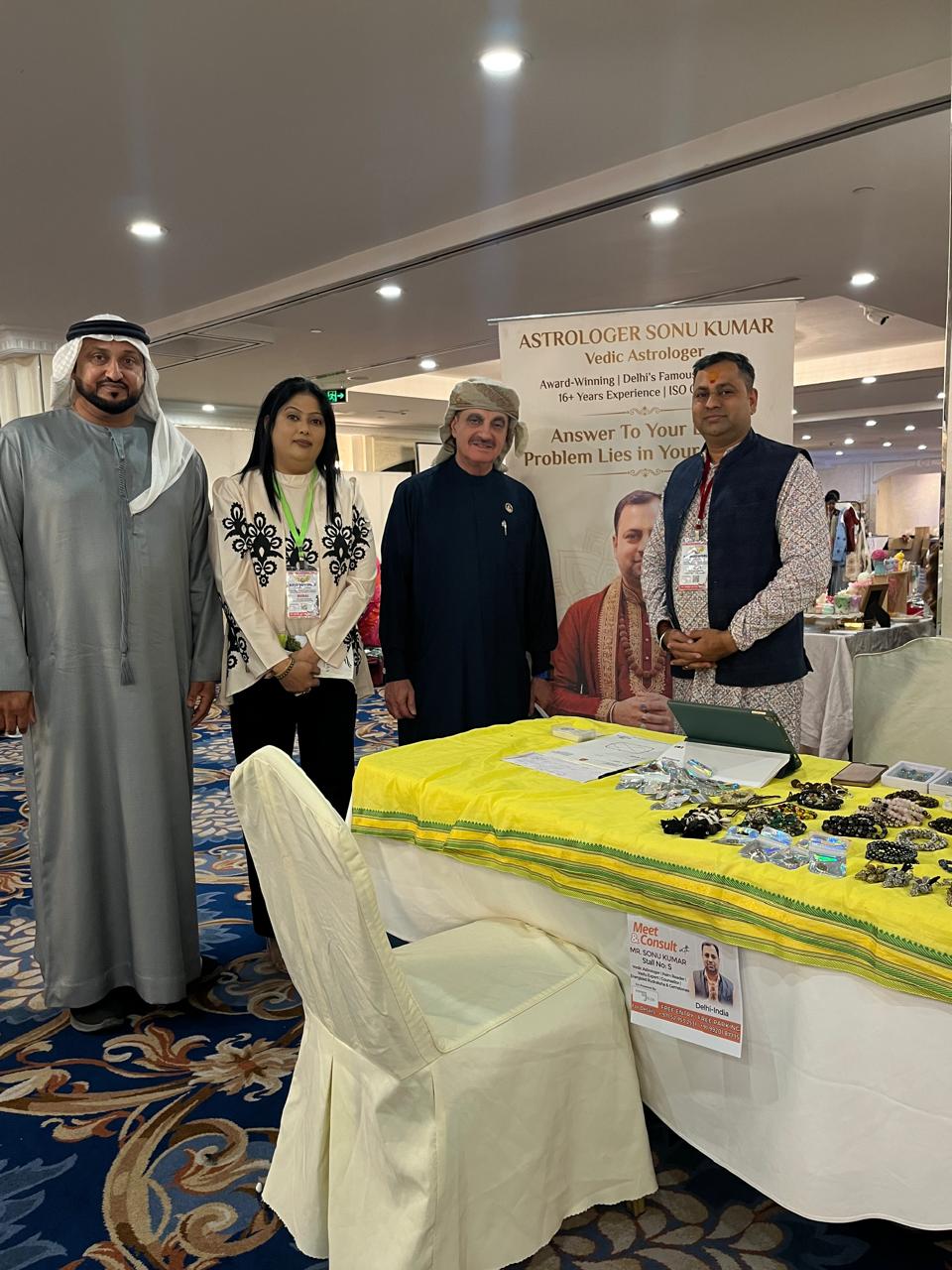 Astro Sonu Kumar at astrology exhibition booth with international guests