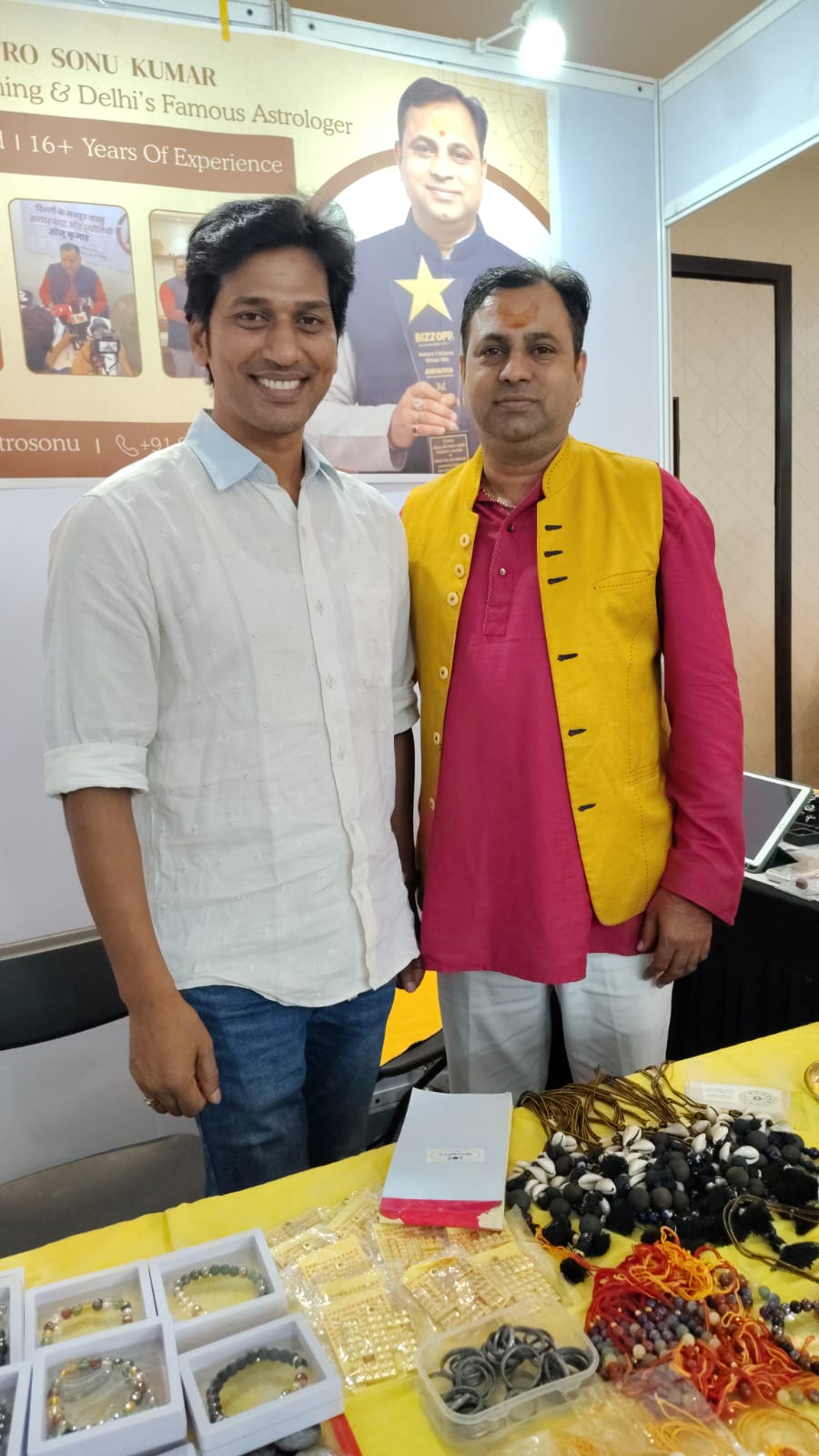 Astro Sonu Kumar at exhibition booth with visitor